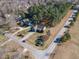 An elevated perspective highlights the home nestled among mature trees with expansive yards in a peaceful neighborhood at 10 Georgetown Woods Dr, Youngsville, NC 27596