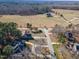Aerial view of the home nestled amongst tall trees on a spacious lot at 10 Georgetown Woods Dr, Youngsville, NC 27596