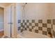 Bathroom featuring a tub and shower with tile surround and a white door for privacy at 10 Georgetown Woods Dr, Youngsville, NC 27596