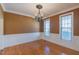 Dining room with hardwood floors, chandelier, and decorative molding at 10 Georgetown Woods Dr, Youngsville, NC 27596