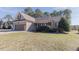 Charming brick home with a well-manicured lawn and a covered front porch at 10 Georgetown Woods Dr, Youngsville, NC 27596