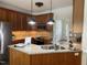 Kitchen with stainless steel appliances, granite countertops, and wood cabinetry at 10 Georgetown Woods Dr, Youngsville, NC 27596