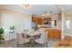 Kitchen with stainless steel appliances and an adjacent dining space, virtually staged at 10 Georgetown Woods Dr, Youngsville, NC 27596
