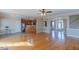 Open-concept living area with hardwood floors, leading to the kitchen and foyer at 10 Georgetown Woods Dr, Youngsville, NC 27596