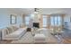 Comfortable living room with fireplace, plush furniture, and abundant natural light at 10 Georgetown Woods Dr, Youngsville, NC 27596