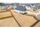 Aerial view of a large, fenced backyard with a new construction home and established landscaping at 1101 Bessie Ct, Wake Forest, NC 27587