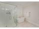 Bright bathroom featuring a glass enclosed shower and standalone soaking tub at 1101 Bessie Ct, Wake Forest, NC 27587
