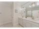This bathroom features double sinks with white cabinets and a large framed mirror at 1101 Bessie Ct, Wake Forest, NC 27587