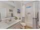 Clean bathroom featuring subway tile, a large mirror and a light grey vanity at 1101 Bessie Ct, Wake Forest, NC 27587