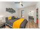 Comfortable bedroom features an attached bathroom, and black-out decorative wall art at 1101 Bessie Ct, Wake Forest, NC 27587