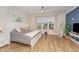 Comfortable bedroom with a large window, stylish decor, and a serene atmosphere at 1101 Bessie Ct, Wake Forest, NC 27587