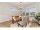 Cozy dining area with a farmhouse-style table, bench seating, and ample natural light at 1101 Bessie Ct, Wake Forest, NC 27587