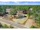 This is an aerial view of a cozy home surrounded by tall trees in a peaceful area at 112 Mckoy Town Rd, Cameron, NC 28326