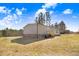 Wide backyard with a beautiful lush lawn and an elevated deck at 112 Mckoy Town Rd, Cameron, NC 28326