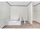 Bathroom featuring a walk-in closet, toilet, and a soaking tub at 112 Mckoy Town Rd, Cameron, NC 28326