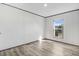 This bedroom offers lots of light from the window and beautiful wood grain flooring at 112 Mckoy Town Rd, Cameron, NC 28326