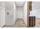 Neutral hallway with modern flooring, utility access and lots of storage space at 112 Mckoy Town Rd, Cameron, NC 28326
