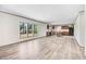 Spacious living room with bright natural light, open floor plan, and wood-look laminate flooring at 112 Mckoy Town Rd, Cameron, NC 28326