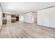 Spacious living room with bright natural light, open floor plan, and wood-look laminate flooring at 112 Mckoy Town Rd, Cameron, NC 28326