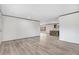 Spacious living area with light wood-look floors, white walls, dark trim and a glimpse of the open kitchen at 112 Mckoy Town Rd, Cameron, NC 28326