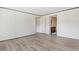 Spacious main bedroom with bright natural light, open floor plan, and wood-look laminate flooring at 112 Mckoy Town Rd, Cameron, NC 28326