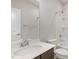 Bathroom featuring a vanity sink, a large mirror, and a shower-tub combo at 113 Callowhill Ln, Durham, NC 27713