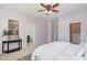 Inviting bedroom with a stylish table, leading to a view of a walk-in closet and ensuite bathroom at 113 Callowhill Ln, Durham, NC 27713