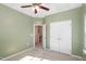 Bright bedroom with neutral carpet, fan light fixture, and ensuite bathroom access at 113 Callowhill Ln, Durham, NC 27713