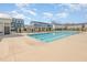 Stunning community pool with lap lanes and lounge area, surrounded by townhomes and a pergola at 113 Callowhill Ln, Durham, NC 27713