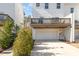 Townhome with a garage, a deck, and beautiful greenery around the property at 113 Callowhill Ln, Durham, NC 27713