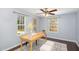 Home office with natural light, neutral tones, large windows, and space for productivity at 113 Callowhill Ln, Durham, NC 27713