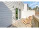 Relaxing wood patio with lounge chairs and sliding glass door entrance at 113 Callowhill Ln, Durham, NC 27713