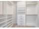 Spacious walk-in closet featuring custom shelving, drawers, and ample hanging space at 113 Callowhill Ln, Durham, NC 27713