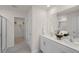 Bathroom featuring double sinks, stand up shower, and walk-in closet at 135 Scenic Rock Dr, Youngsville, NC 27596