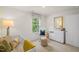 Comfortable Bedroom with a white crib, natural light, and coordinated decor at 135 Scenic Rock Dr, Youngsville, NC 27596