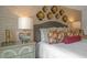Bedroom features an accent wall and decorative lighting at 135 Scenic Rock Dr, Youngsville, NC 27596
