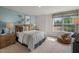 This cozy bedroom features a bean bag chair and lots of natural light at 135 Scenic Rock Dr, Youngsville, NC 27596