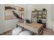 Stylish home office featuring a wooden desk, comfortable chair, and decorative shelving at 135 Scenic Rock Dr, Youngsville, NC 27596