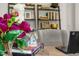 Close-up of a well-decorated desk in a home office, with flowers and decorative objects at 135 Scenic Rock Dr, Youngsville, NC 27596