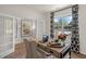 Bright home office featuring a rustic wooden desk, patterned curtains, and natural light at 135 Scenic Rock Dr, Youngsville, NC 27596