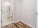 Bright bathroom featuring a shower-tub combination with modern fixtures and neutral tile floors at 1430 Rosepine Dr, Cary, NC 27519