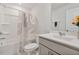Full bathroom featuring modern vanity, mirror and shower-tub with decorative curtain at 1430 Rosepine Dr, Cary, NC 27519