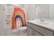 Bathroom featuring a bathtub with rainbow curtain, tile floor, and vanity with grey cabinets at 1430 Rosepine Dr, Cary, NC 27519
