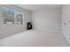 A spacious bedroom bathed in natural light from the large window, showcasing a neutral color palette and minimalist design at 1430 Rosepine Dr, Cary, NC 27519