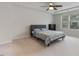Bedroom with tray ceiling, ceiling fan and plenty of natural light at 1430 Rosepine Dr, Cary, NC 27519