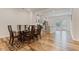 Open floor plan with dining area and a glass table for six adjacent to the kitchen at 1430 Rosepine Dr, Cary, NC 27519