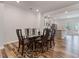 Open floor plan with dining area and a glass table for six adjacent to the kitchen at 1430 Rosepine Dr, Cary, NC 27519