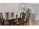 Open floor plan with dining area and a glass table for six adjacent to the kitchen at 1430 Rosepine Dr, Cary, NC 27519