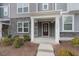 Inviting front porch with stone accents and a covered entry offers a welcoming entrance to the home at 1430 Rosepine Dr, Cary, NC 27519