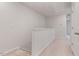 Hallway with neutral carpet, white trim, and a glimpse of other rooms at 1430 Rosepine Dr, Cary, NC 27519